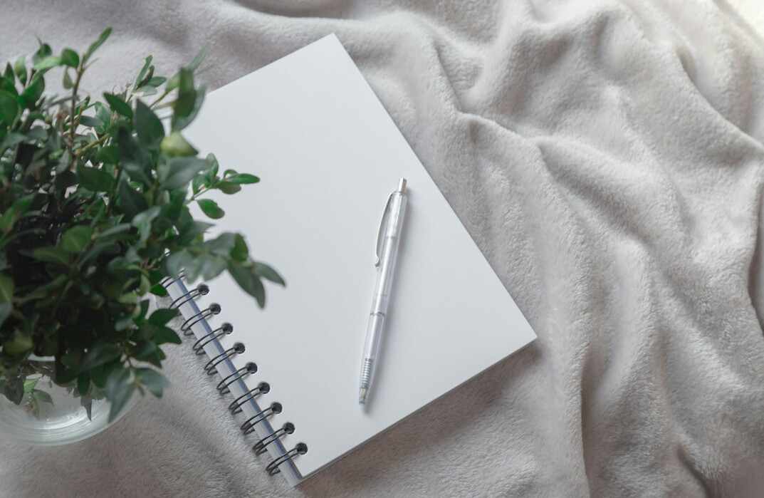 Open notebook and pen symbolizing thoughtful communication and ideas