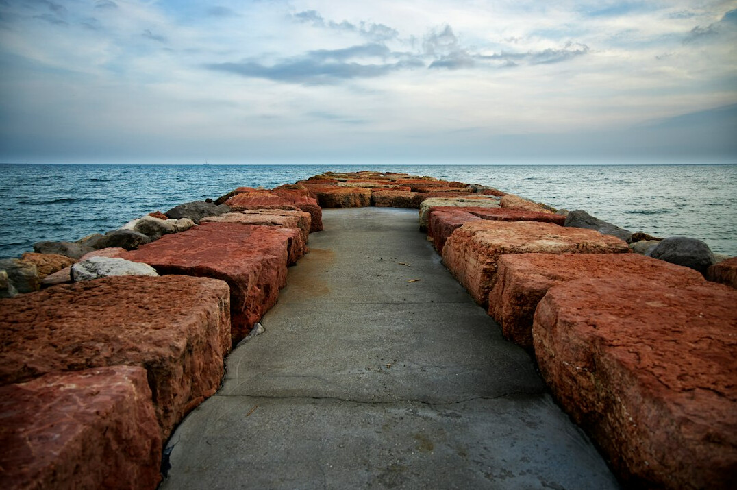 Stone bridge over calm water symbolizing trust and integrity in leadership