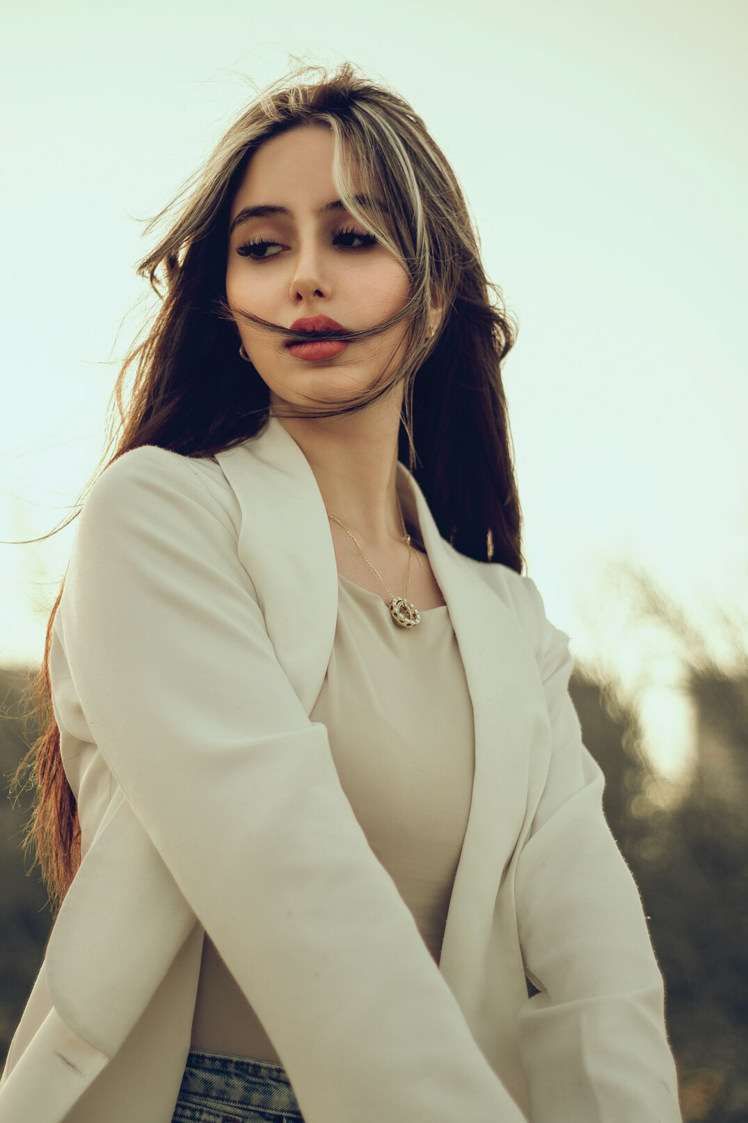Professional portrait of a Belgian woman in business attire, coordinator of the forum