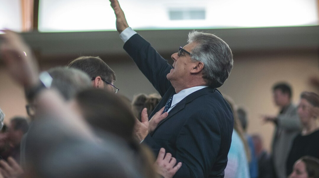 Speaker addressing an attentive audience at a leadership conference